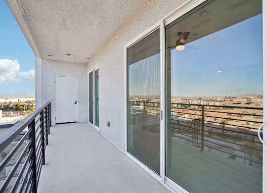 A balcony with a view of a cityscape.