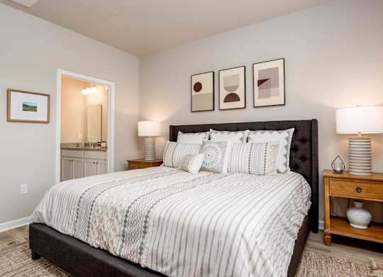 a bedroom with a bed and two night stands