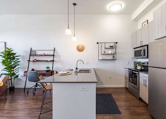a kitchen with a counter top and a refrigerator