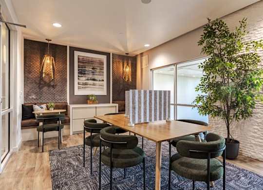 a dining room with a table and chairs
