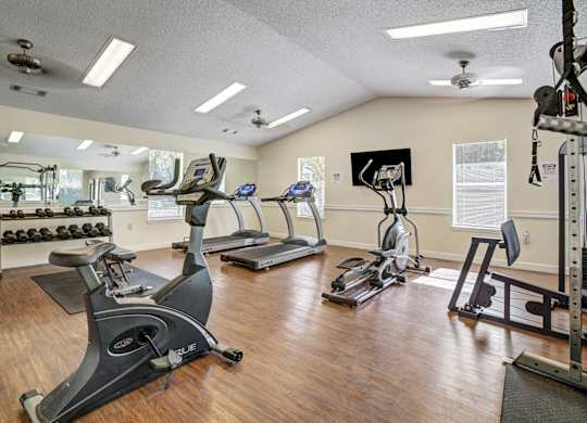 Modern, fully equipped apartment fitness center at Chelsea Apartments in Gainesville