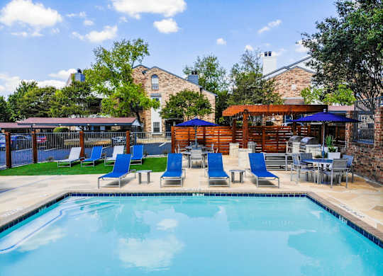 cottages at wells branch  pool with poolside loungers