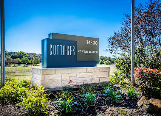 cottages at wells branch  main entrance sign