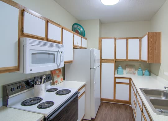 Enclave at Wolfchase Apartments in Cordova Tennessee photo of kitchen with hardwood floors