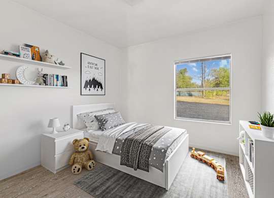 Bedroom with large window at Huntington Meadows Apartments in Austin, TX 78724