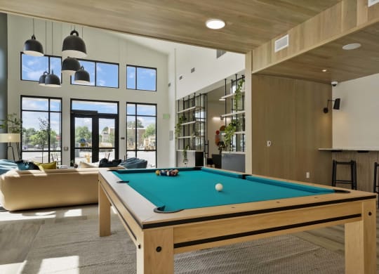 a pool table in the living room of a house