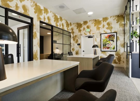 a hotel lobby with a counter and chairs
