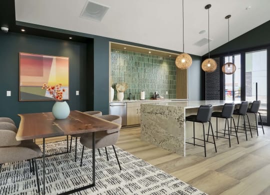 a dining room with a table and chairs and a kitchen