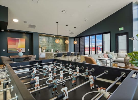 a game room with a foosball table