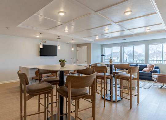 A modern living room with a bar area and a television.