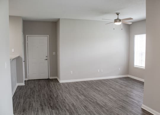 Enclave at Wolfchase Apartments in Cordova Tennessee photo of an empty living room with a ceiling fan