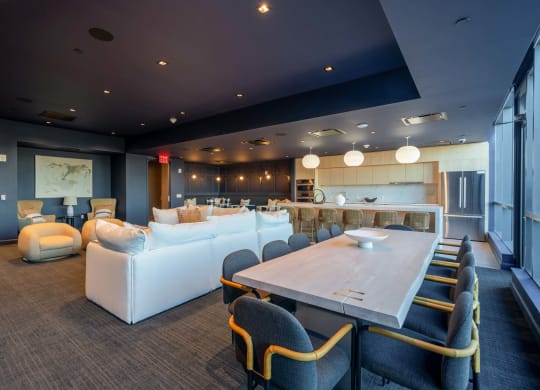 a living room and dining room with couches and a table