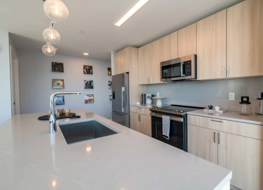 a kitchen with a large counter top and a sink