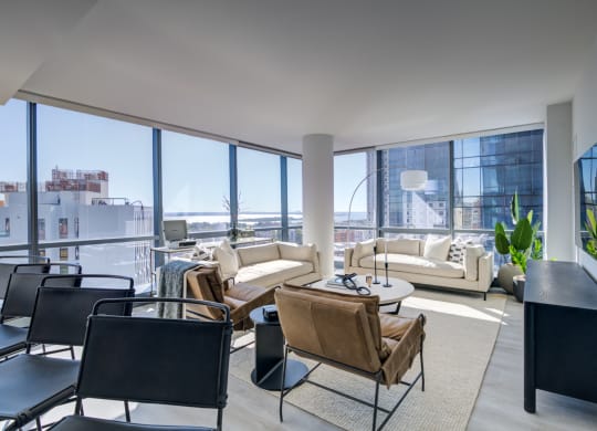 a living room filled with furniture and a large window