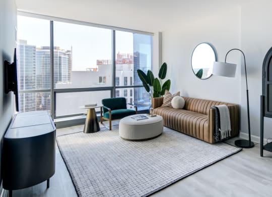 a living room with a couch and a large window