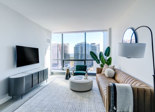 a living room with a couch and a large window