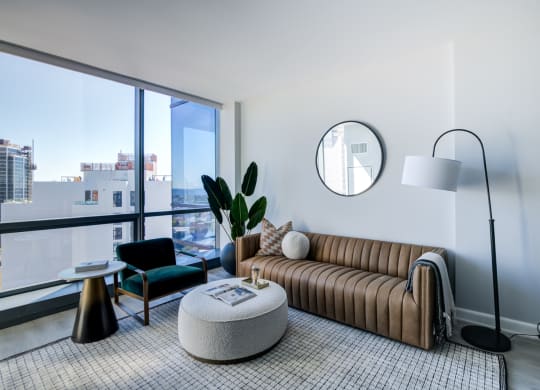 a living room with a couch and a large window
