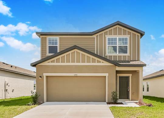 A two-story house with a garage is shown.