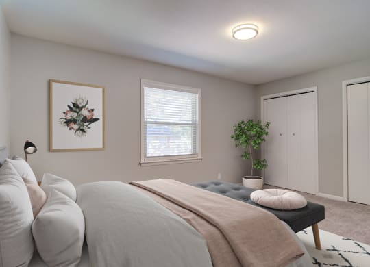 Estuary Apartments in Atlanta Georgia 30341 photo of a bedroom with a large bed and two closets