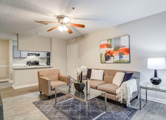 Spacious living room with modern design at Flats at River View apartments in Duluth, GA, near Lawrenceville.
