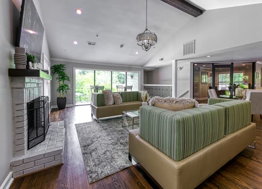 a living room with couches and a fireplace