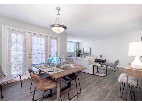 Spacious living and dining room at Springdale Glen, a pet-friendly community in Clarkston, GA, near Decatur.