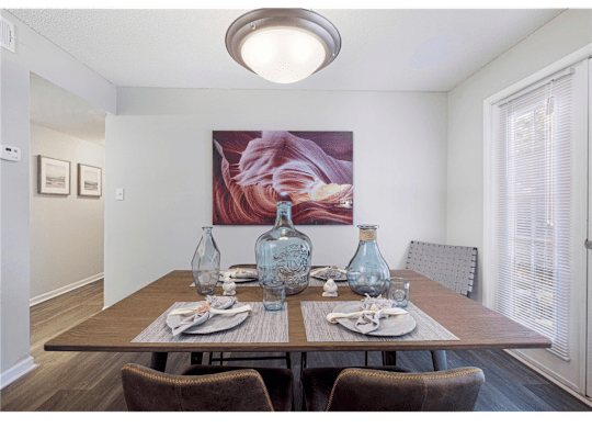 Dining room with a large window and abundant natural light at Springdale Glen, a pet-friendly community in Clarkston, GA, near Decatur.