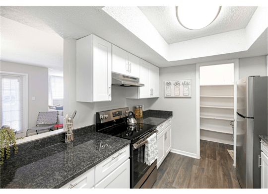 Spacious kitchen with a large pantry at Springdale Glen, a pet-friendly community in Clarkston, GA, near Decatur.