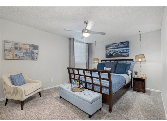 Bright bedroom featuring large windows at Springdale Glen, a pet-friendly community in Clarkston, GA, near Decatur.