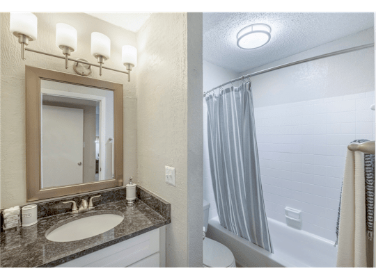 Bathroom featuring a combined shower and tub at Springdale Glen, a pet-friendly community in Clarkston, GA, near Decatur.