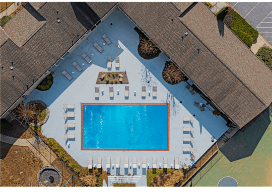 Resort-inspired pool with sundeck at Springdale Glen, a pet-friendly community in Clarkston, GA, near Decatur.