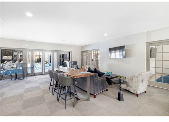 Spacious clubroom featuring cozy seating areas at Springdale Glen, a pet-friendly community in Clarkston, GA, near Decatur.