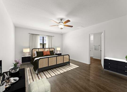 A bedroom with a bed, nightstand, and a dresser.