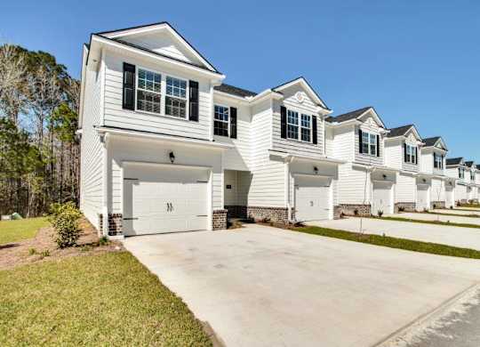 Harris Trail Luxury Townhomes for rent Richmond Hill, GA photo of townhomes with garages and driveways
