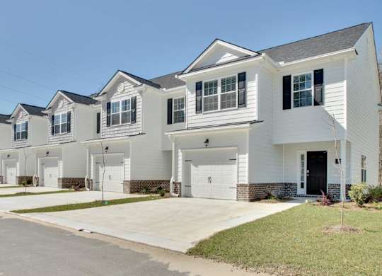 Harris Trail Luxury Townhomes for rent Richmond Hill, GA photo of townhomes with garages and driveways