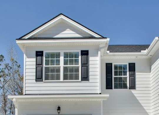 Harris Trail Luxury Townhomes for rent Richmond Hill, GA photo of white townhome with garage
