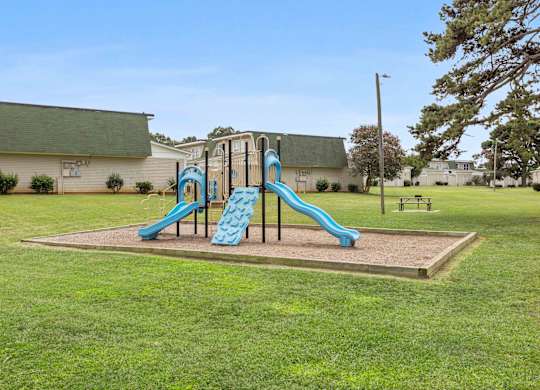 Community playground with safe play structures at Hunters Pointe apartments in Charlotte, NC 28213, near UNC Charlotte.
