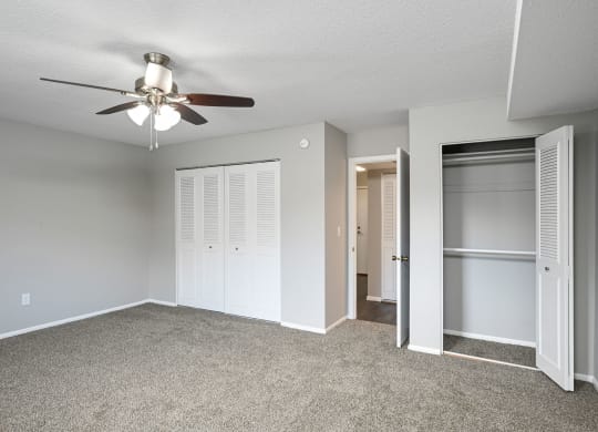 Laurel West End Apartments in Golden Valley, MN photo of bedroom with multiple closets and plush carpeting