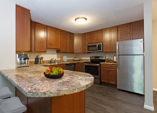 Laurel West End Apartments in Golden Valley, MN photo of kitchen with hardwood floors and stainless steel appliances