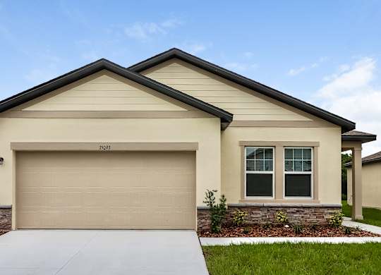 A beige house with a garage door that says 3509.