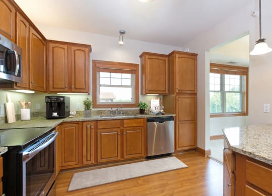 Laurel East End Apartments in Golden Valley, MN photo of a kitchen with wooden cabinets