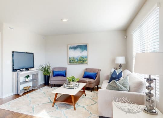 a living room with a couch and a tv