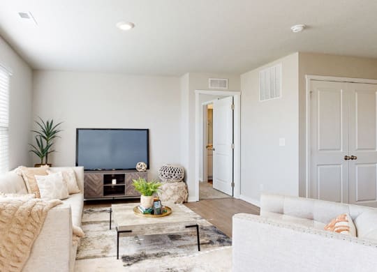 a living room with a couch and a tv