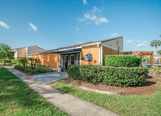 Apartments in Kissimmee for Rent - Mirador at Woodside - Leasing Office with Beautiful Landscaping