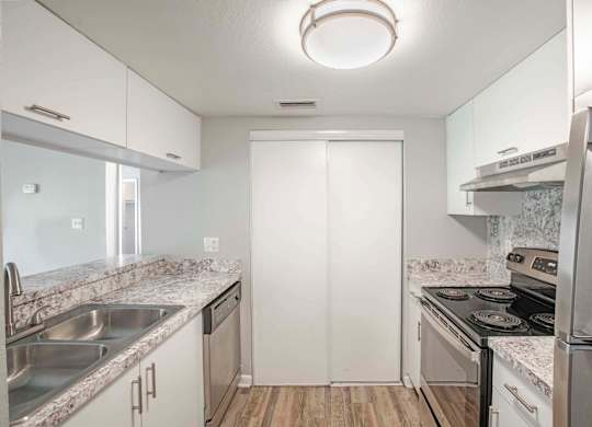 Pet-Friendly Apartments in Kissimmee, FL- Mirador at Woodside - Gourmet Kitchen with Pantry and Cabinet Space