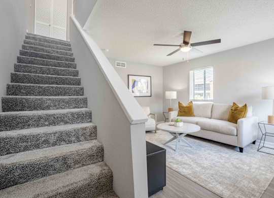 Kissimmee, Florida Apartments - Mirador at Woodside - Living Room Area with Staircase to Upstairs
