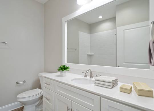 Bathroom at Mirador at Peachtree in Atlanta, Georgia, near Briarcliff, featuring a single vanity and large mirror