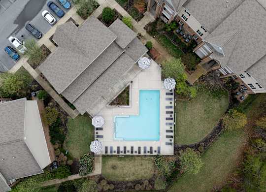 One, Two and Three- Bedroom Apartments for Rent in Sevierville, TN – Overlook at Allensville – A bird's eye view of a clubhouse with a swimming pool.
