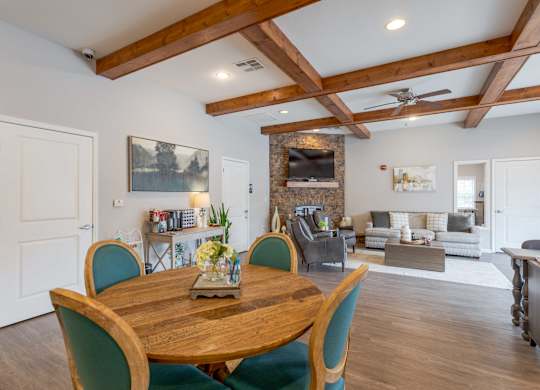 One, Two and Three- Bedroom Apartments for Rent in Sevierville, TN – Overlook at Allensville – clubhouse seating area with dining table and chairs
