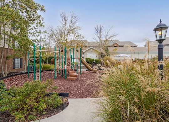 Apartments in Sevierville for Rent – Overlook at Allensville -   A playground with a swing set and a slide.